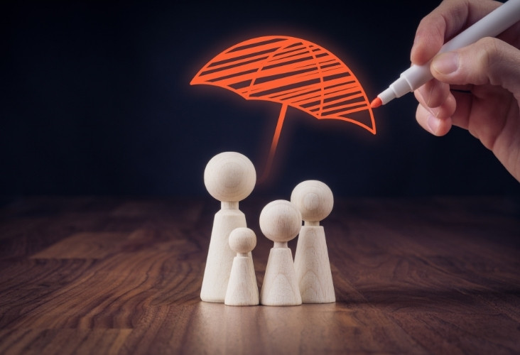 umbrella on family depicting insurance